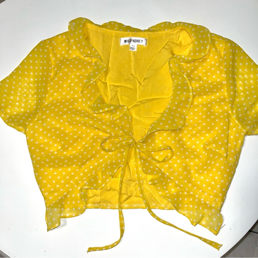 Super cute polka dot tie front crop top with ruffle detail